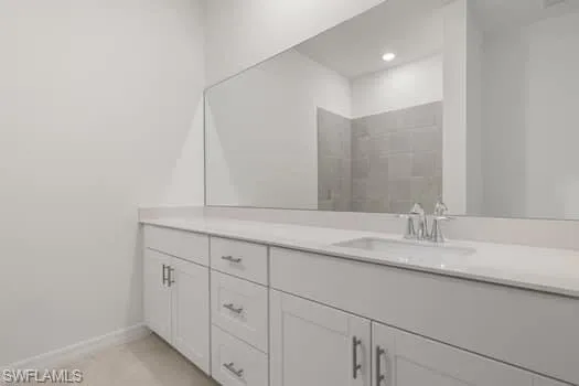 Bathroom featuring vanity and baseboards