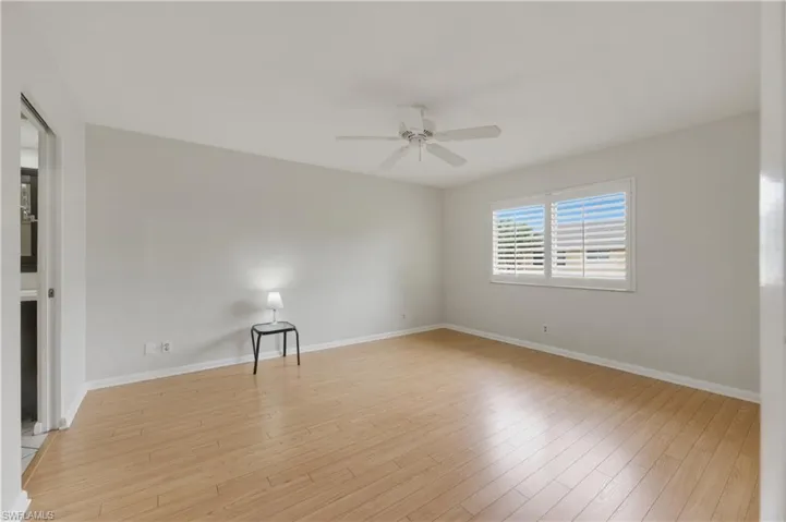 Master Bedroom with light wood-style flooring and ceiling fan