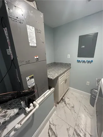 Utility Room with washer, dryer and folding / storage area