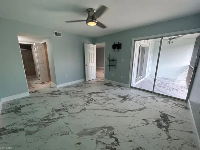 Main bedroom with sliding glass door to balcony