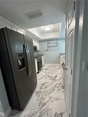 Kitchen with new cabinetry and stainless appliances