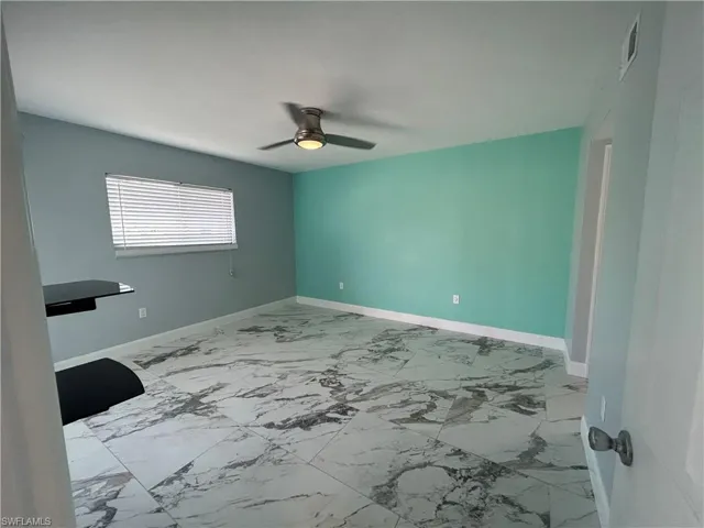 Main bedroom with tile flooring