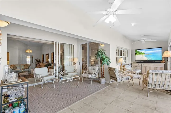 Incredible amount extra space in this approx. 385 sq.ft. Florida room which features tile floors, ceiling fans, sliders with golf curse view.