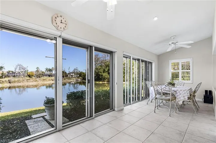 Incredible water to golf course views from the expansive Florida room of this attached villa.Sun room is approx. 385 sq.ft. of year round living space.