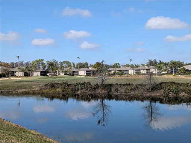 Expansive lake to golf course views from the sun room of this condo.Unit over looks hole #13 of the Loch Ness golf course.