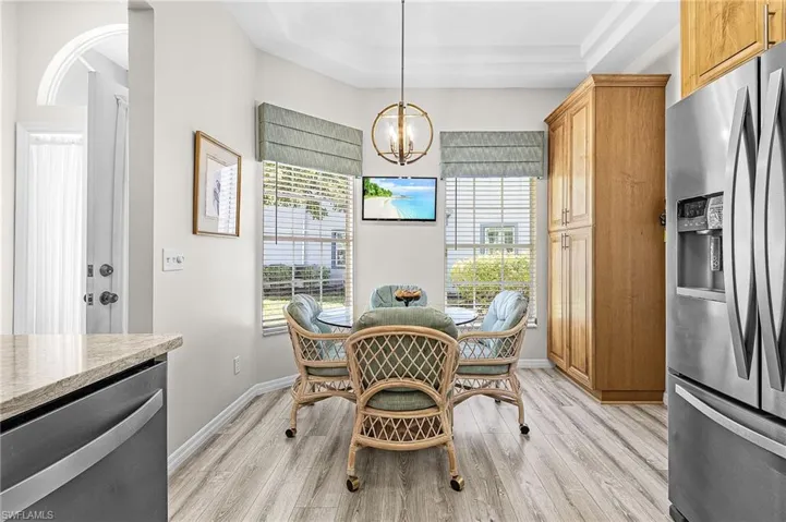 Kitchen features an breakfast nook and pantry cabinetry.