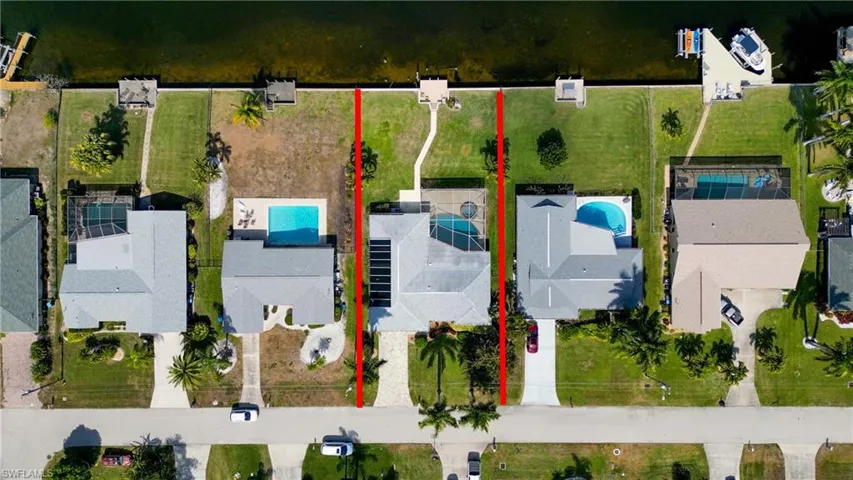 Aerial view of residential area featuring property boundaries highlighted