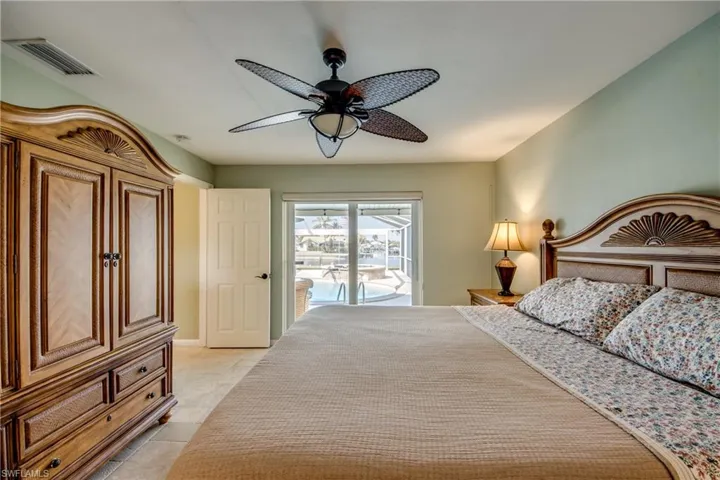 Bedroom with access to outside and a ceiling fan
