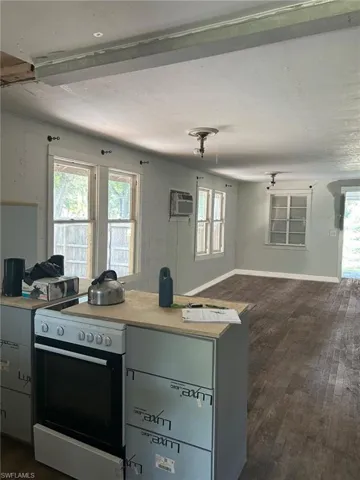 Kitchen overlooking livingroomVirtually staged with no furnishings