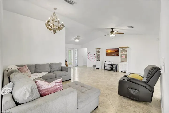 Living area with a chandelier and ceiling fan