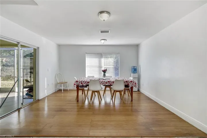 Dining room with healthy amount of natural light and light wood finished floors