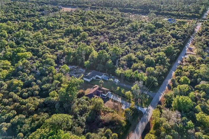 View of property location with a forest