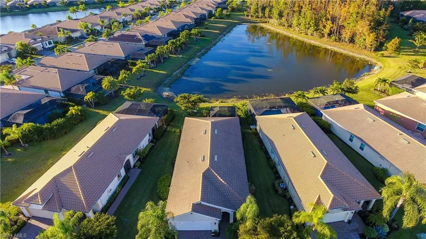 Aerial view of residential area with a large body of water