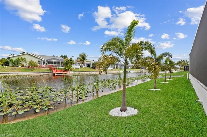View of yard with a water view