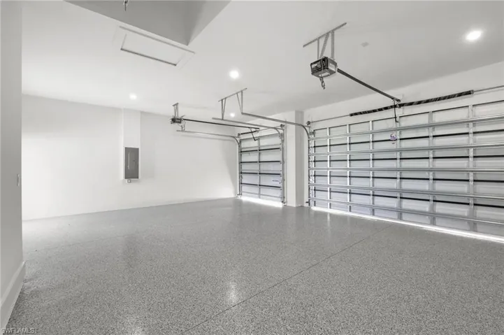 Garage with a garage door opener and electric panel