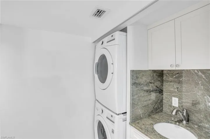 Custom Laundry space with full size W/D and sink