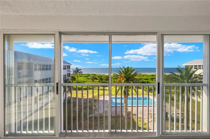 Unfurnished sunroom featuring a water view