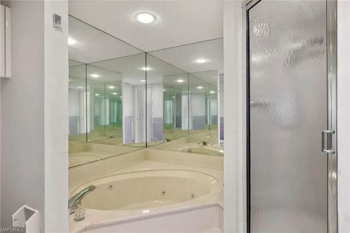 Bathroom with shower with separate bathtub
