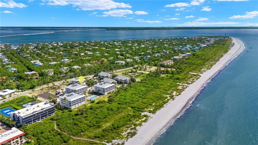 Drone / aerial view with a water view and a view of the beach