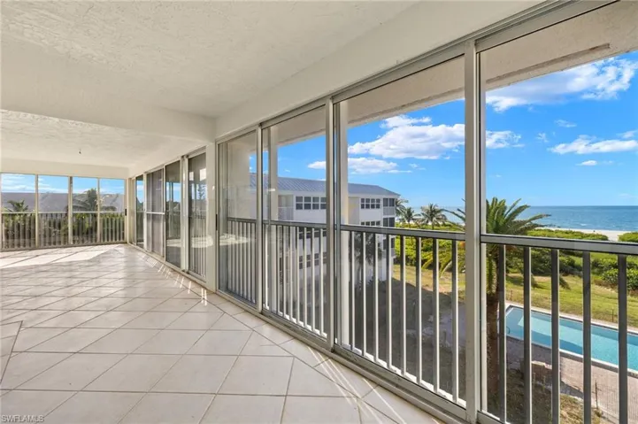 Unfurnished sunroom featuring a water view