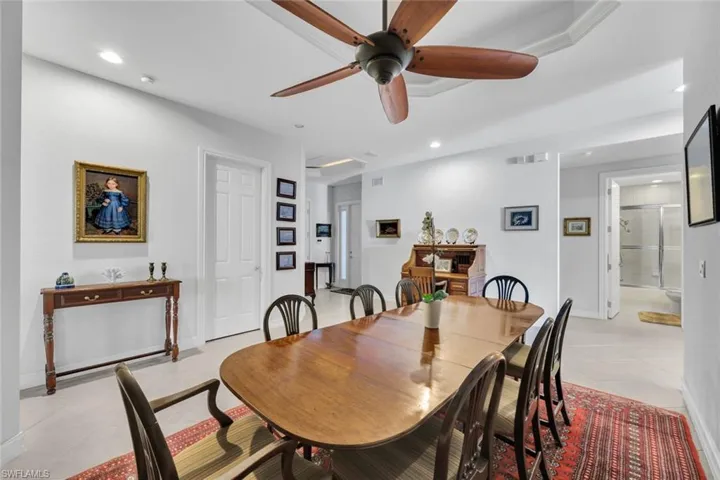 Dining space featuring ceiling fan and light tile patterned floors