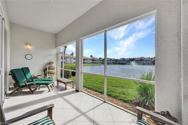 Sunroom / solarium with a water view