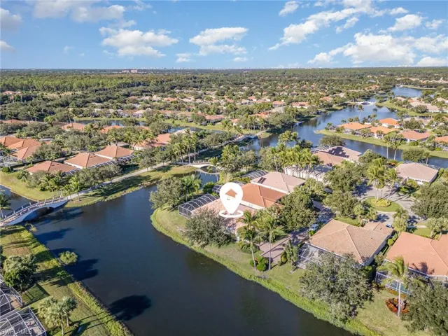 Aerial perspective of suburban area with a large body of water