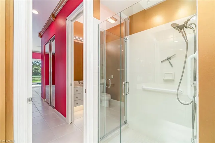 Full bathroom with tile patterned floors, a shower stall, and recessed lighting