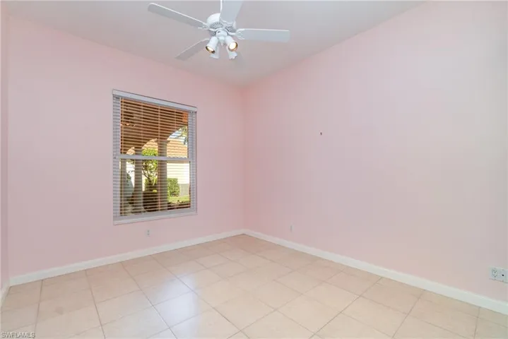 Empty room featuring baseboards