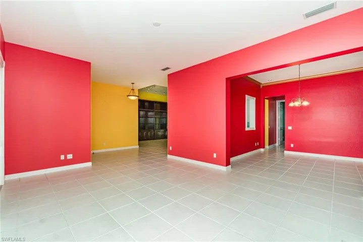 Spare room with light tile patterned floors and baseboards