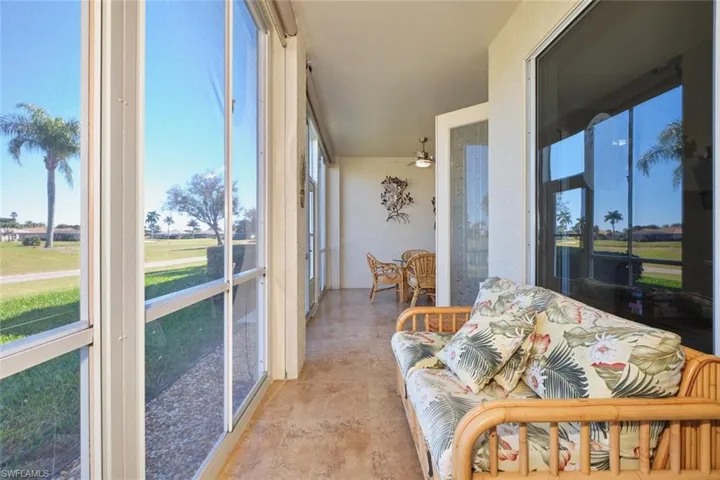 Sunroom featuring plenty of natural light and a ceiling fan