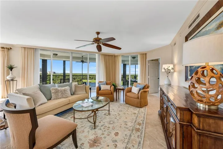 Living area with floor to ceiling glass doors