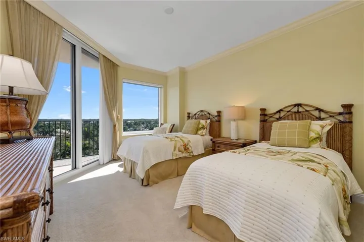 2nd Bedroom with balcony & private bath.