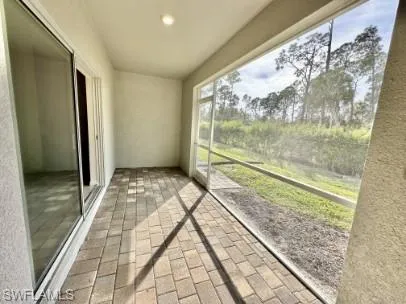 Screened outdoor patio featuring paver flooring, recessed lighting, and sliding glass door access