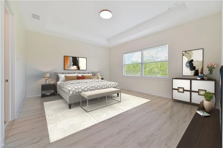 Primary bedroom with ensuite attached bathroom