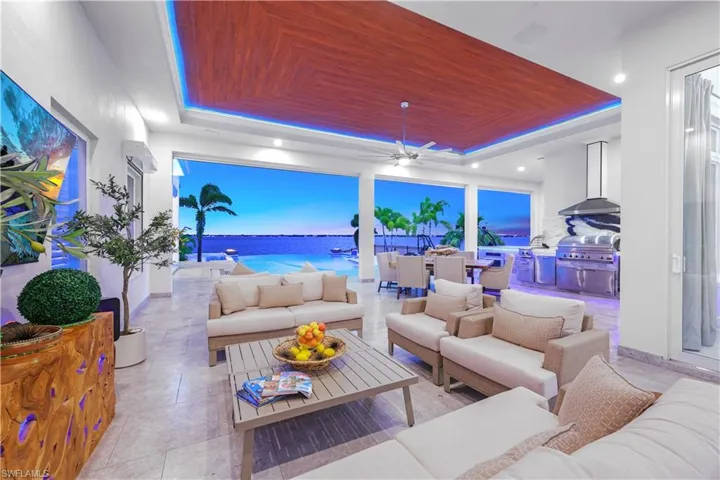 View of patio / terrace with a water view, ceiling fan, outdoor lounge area, and outdoor dining area