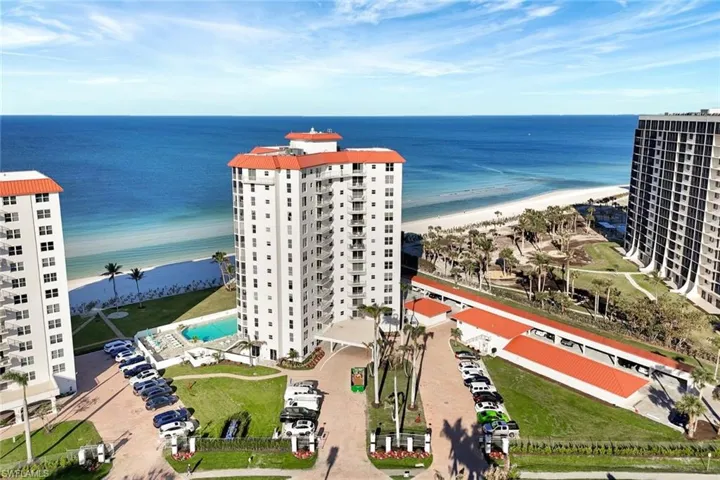 Bird's eye view featuring a water view and a view of the beach