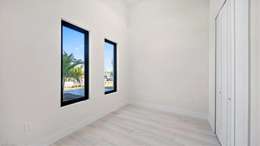 Unfurnished bedroom featuring a closet and light wood-style flooring