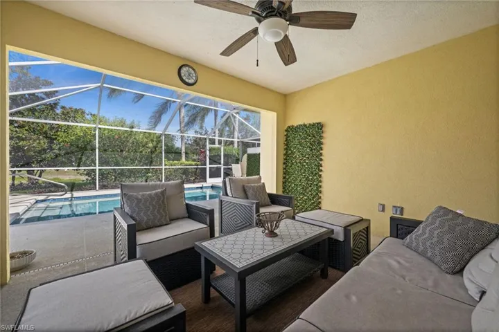 View of patio / terrace with a sunroom, an outdoor hangout area, a lanai, and an outdoor pool