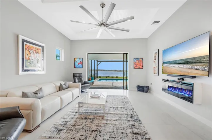 Tiled living room featuring ceiling fan