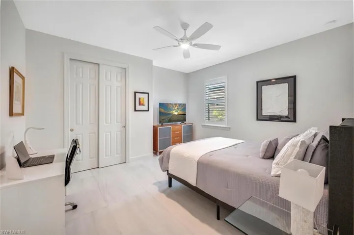 Bedroom featuring a closet and ceiling fan