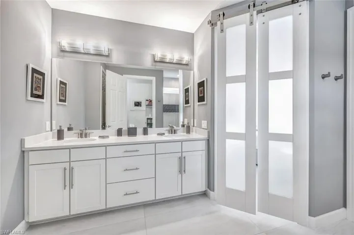 Bathroom featuring vanity and tile patterned flooring