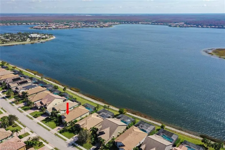 Aerial of property with a water view of 240 Acre Lake