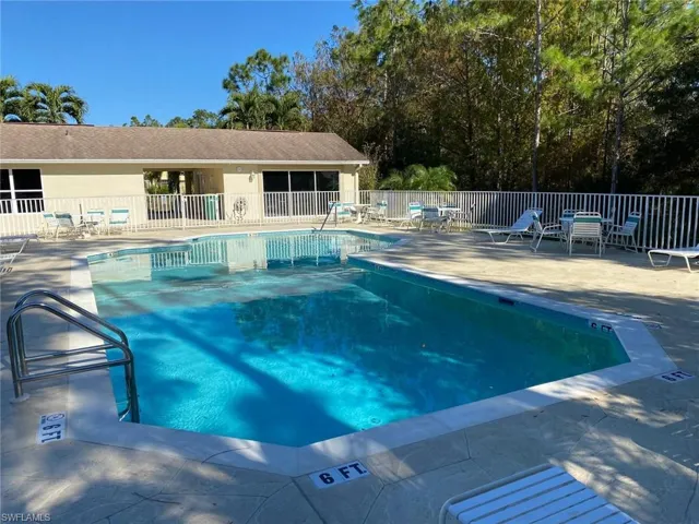 Community pool featuring a patio