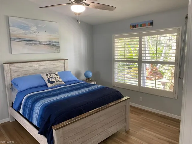 Bedroom featuring a ceiling fan and wood finished floors