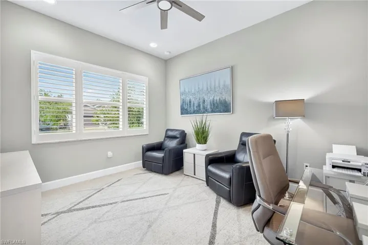 Located on the front of the house and to the left of the foyer, this den is super bright!