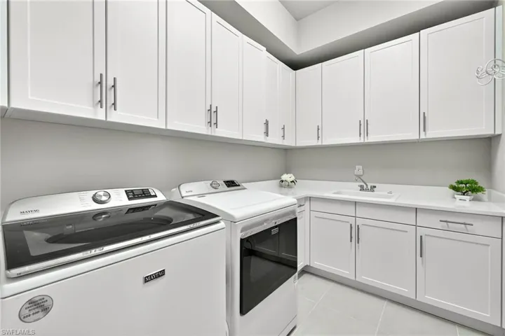 UPGRADED washer and dryer...plus a large utility tub and cabinets galore!!!