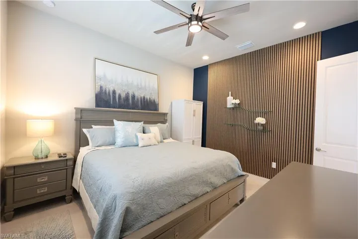 3rd Bedroom or Den featuring an accent wall, and a ceiling fan