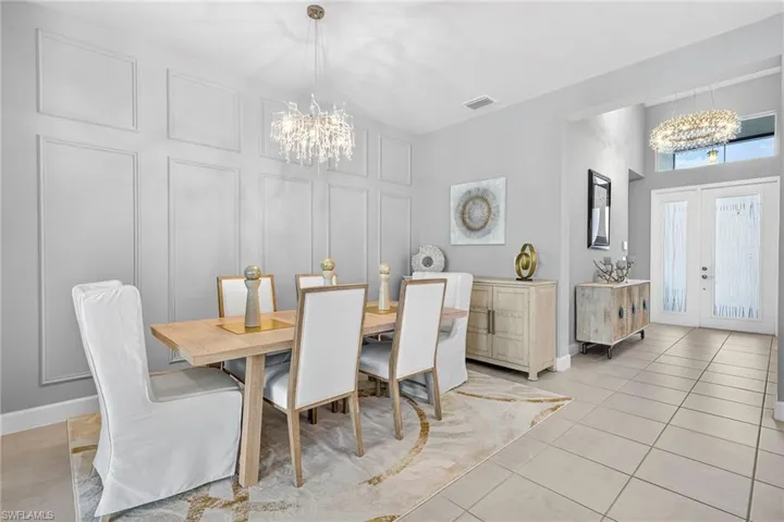BEAUTIFUL decorative picture frame accent wall in dining area...
