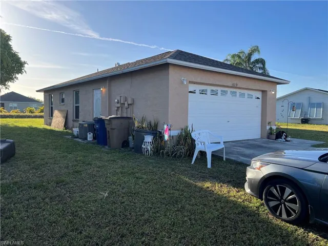 Garage has side door entrance